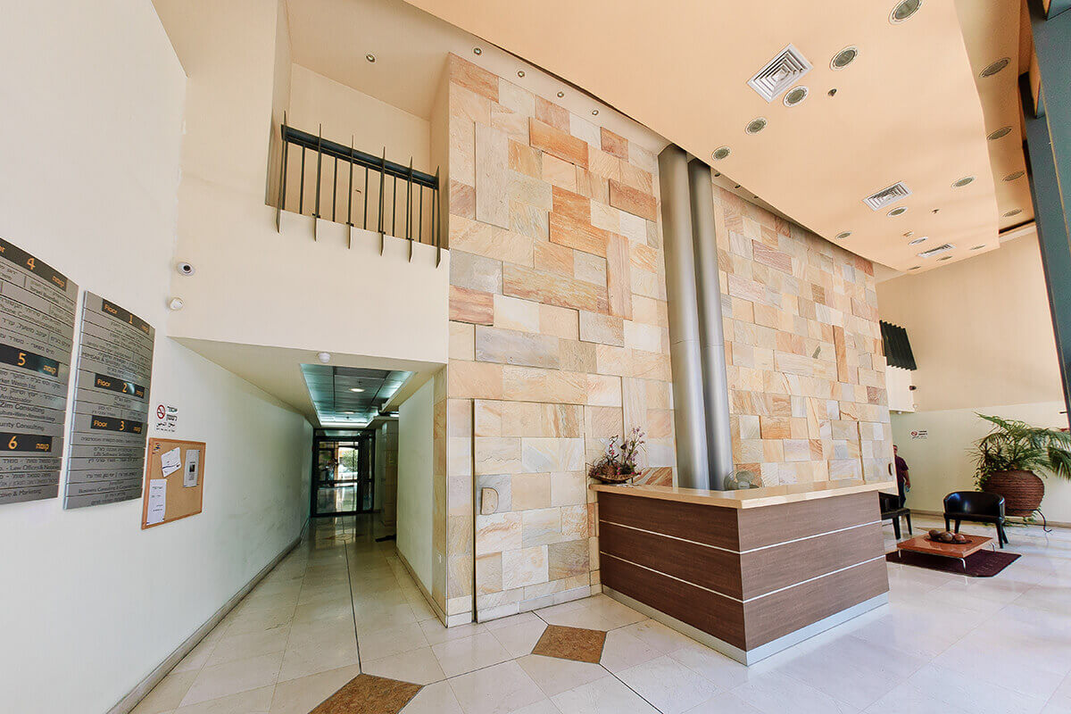 Photograph of the lobby of a building from the America Israel House project in Ramat Gan